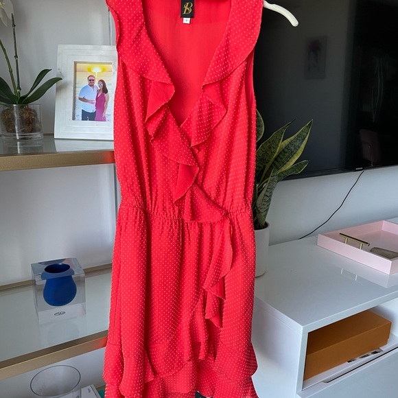 Cute red dress with small white polka dots and ruffle detailing. - Picture 3 of 3